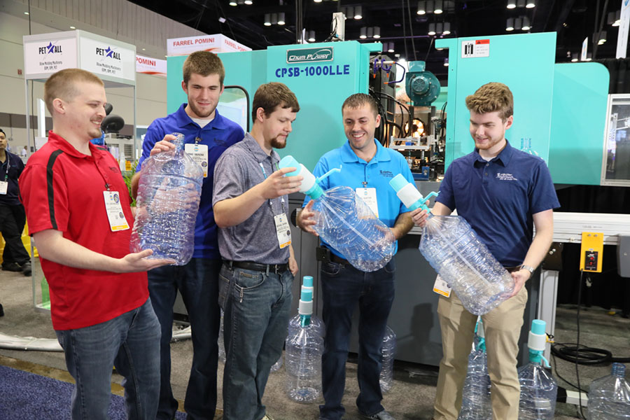 Students holding bottles at NPE